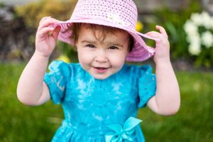 A girl wearing a pink hat